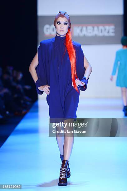 Model walks the runway at the Goga Nikabadze show during Mercedes-Benz Fashion Week Russia Fall/Winter 2013/2014 at Manege on March 31, 2013 in...