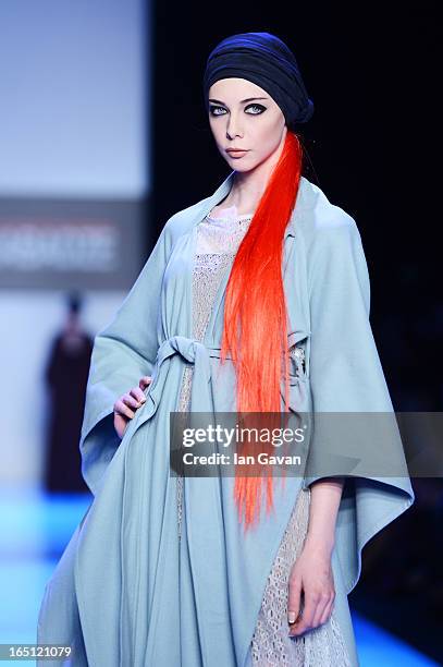 Model walks the runway at the Goga Nikabadze show during Mercedes-Benz Fashion Week Russia Fall/Winter 2013/2014 at Manege on March 31, 2013 in...