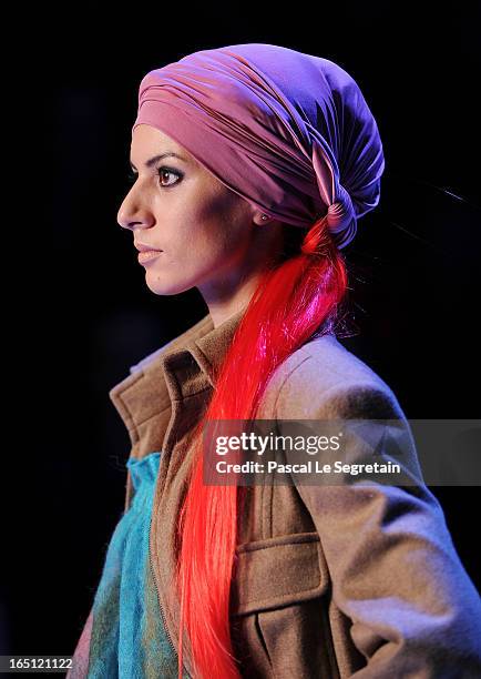 Model walks the runway at the Goga Nikabadze show during Mercedes-Benz Fashion Week Russia Fall/Winter 2013/2014 at Manege on March 31, 2013 in...