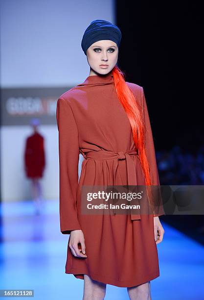 Model walks the runway at the Goga Nikabadze show during Mercedes-Benz Fashion Week Russia Fall/Winter 2013/2014 at Manege on March 31, 2013 in...