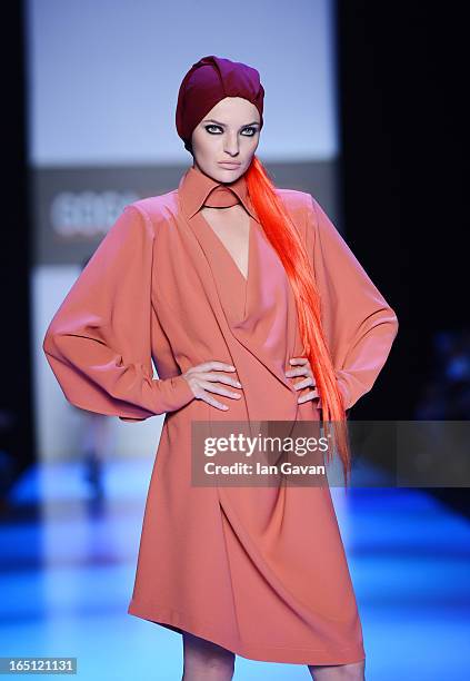 Model walks the runway at the Goga Nikabadze show during Mercedes-Benz Fashion Week Russia Fall/Winter 2013/2014 at Manege on March 31, 2013 in...