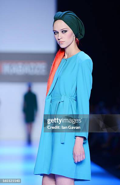 Model walks the runway at the Goga Nikabadze show during Mercedes-Benz Fashion Week Russia Fall/Winter 2013/2014 at Manege on March 31, 2013 in...