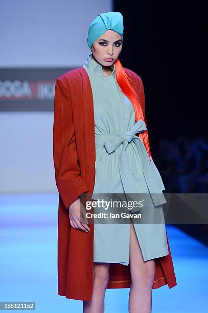 Model walks the runway at the Goga Nikabadze show during Mercedes-Benz Fashion Week Russia Fall/Winter 2013/2014 at Manege on March 31, 2013 in...