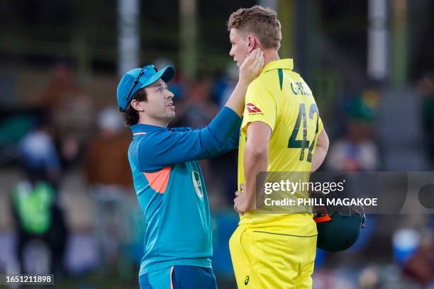 Australia's Cameron Green receives medical attention after being hit by a ball on the head during the first one-day international cricket match...