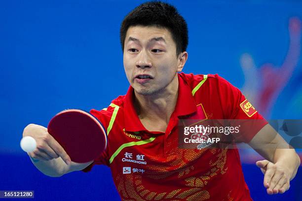 Ma Long of China returns against Jung Youngsik of Chinese Taipei in the finals at the World Team Classic Table Tennis game in Guangzhou, east China's...