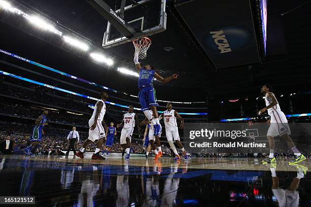 Sherwood Brown of the Florida Gulf Coast Eagles goes up against the Florida Gators during the South Regional Semifinal round of the 2013 NCAA Men's...