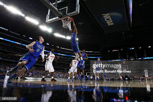 Sherwood Brown of the Florida Gulf Coast Eagles goes up against the Florida Gators during the South Regional Semifinal round of the 2013 NCAA Men's...