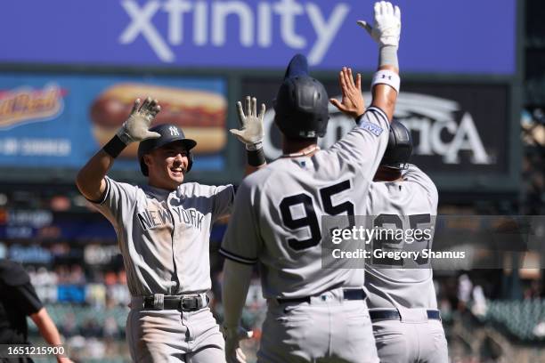 Anthony Volpe of the New York Yankees celebrates his three run home run in the ninth inning with Oswaldo Cabrera and Gleyber Torres while playing the...