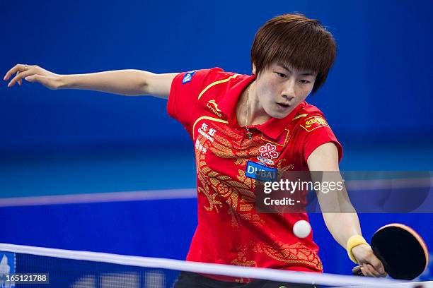 Ding Ning of China returns a shot during the final game with her teammate Li Xiaoxia against Hirana Sayaka and Ishikawa Kasumiof of Japan at the...