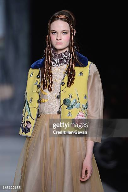 Model walks the runway at the Tatyana Parfionova show during Mercedes-Benz Fashion Week Russia Fall/Winter 2013/2014 at Manege on March 31, 2013 in...