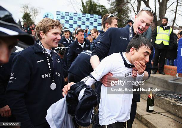 Oskar Zorrilla of Oxford, the winning cox recovers after being thrown into the River Thames after the BNY Mellon 159th Oxford versus Cambridge...