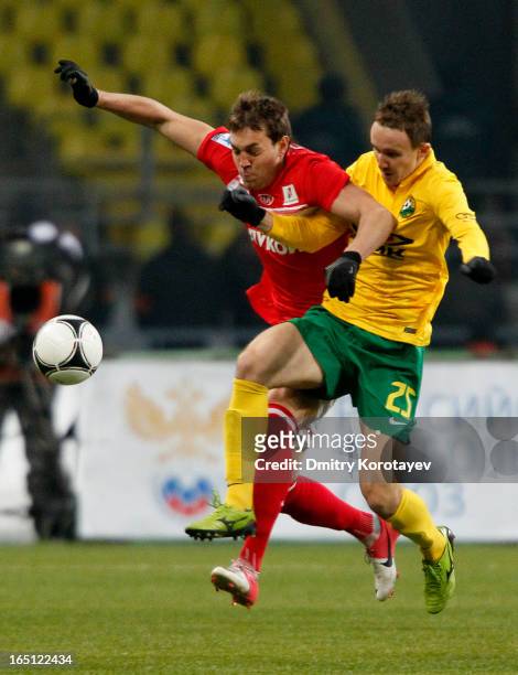 Artem Dzyuba of FC Spartak Moscow battles for the ball with Aleksei Kozlov of FC Kuban Krasnodar during the Russian Premier League match between FC...