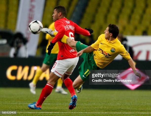 Rafael Carioca of FC Spartak Moscow battles for the ball with Gheorghe Bucur of FC Kuban Krasnodar during the Russian Premier League match between FC...