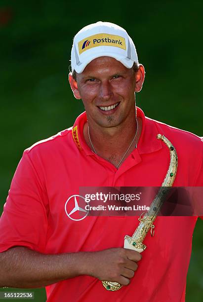 Marcel Siem of Germany poses with the trophy dagger after winning the Trophee du Hassan II Golf on a score of -17 under par at Golf du Palais Royal...