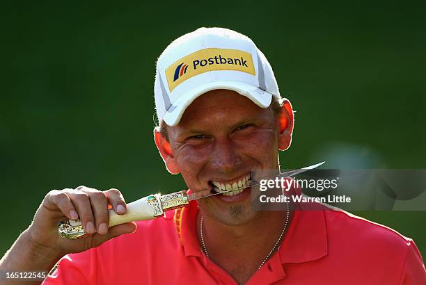 Marcel Siem of Germany poses with the trophy dagger after winning the Trophee du Hassan II Golf on a score of -17 under par at Golf du Palais Royal...