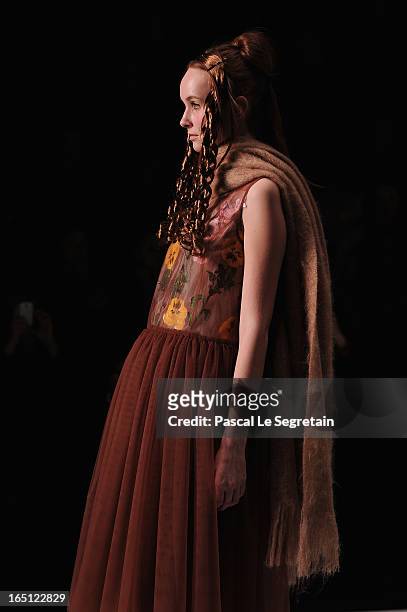 Model walks the runway at the Tatyana Parfionova show during Mercedes-Benz Fashion Week Russia Fall/Winter 2013/2014 at Manege on March 31, 2013 in...