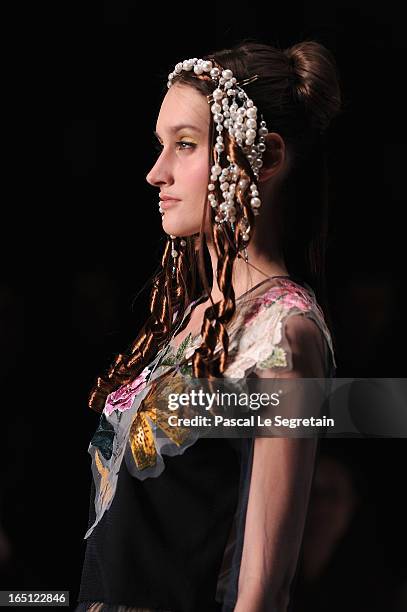 Model walks the runway at the Tatyana Parfionova show during Mercedes-Benz Fashion Week Russia Fall/Winter 2013/2014 at Manege on March 31, 2013 in...