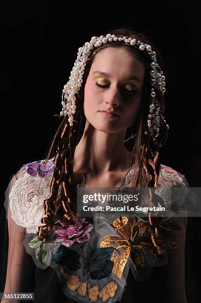 Model walks the runway at the Tatyana Parfionova show during Mercedes-Benz Fashion Week Russia Fall/Winter 2013/2014 at Manege on March 31, 2013 in...