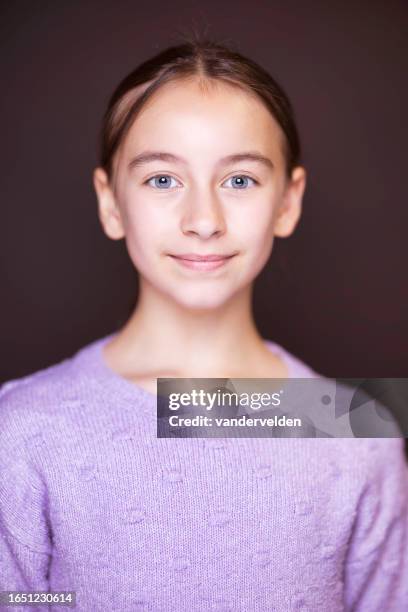 portrait of a brunette with blue eyes - purple lilac stock pictures, royalty-free photos & images