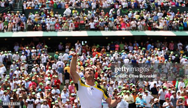 Andy Murray of Great Britain throws his sweat band to the spectators after his three set victory against David Ferrer of Spain during their final...