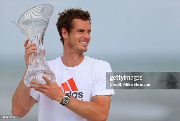 Andy Murray of Great Brittain poses on the beach at Key Biscayne after winning the final of the Sony Open against David Ferrer of Spain at Crandon...