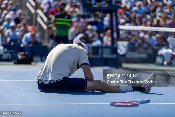 August 31: John Isner of the United States after falling during his match against Michael Mmoh of the United States in the Men's Singles round two...