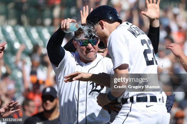 Parker Meadows of the Detroit Tigers is showered with Gatorad by Spencer Torkelson after beating the New York Yankees 4-3 in ten innings at Comerica...