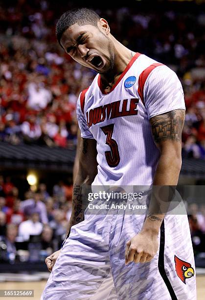 Peyton Siva of the Louisville Cardinals reacts in the first half against the Duke Blue Devils during the Midwest Regional Final round of the 2013...