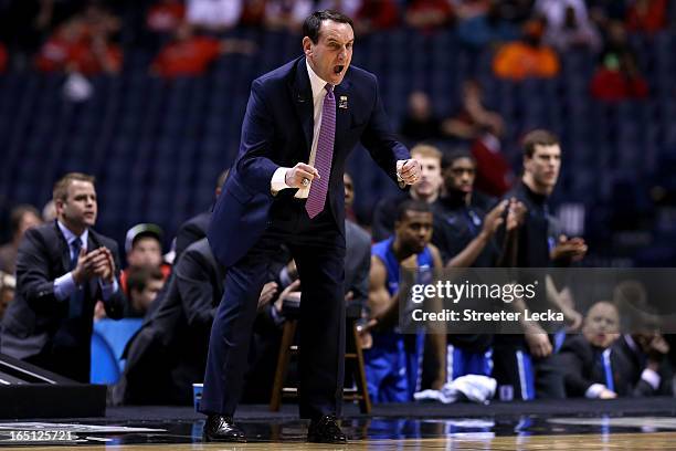 Head coach Mike Krzyzewski of the Duke Blue Devils reacts as he coaches in the first half against the Louisville Cardinals during the Midwest...