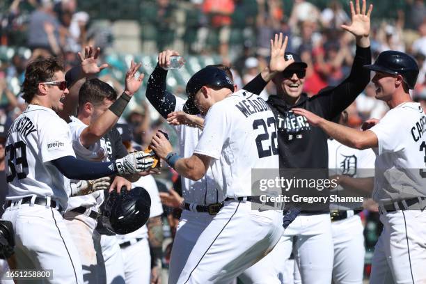Parker Meadows of the Detroit Tigers celebrates a 4-3 win over the New York Yankees with teammates at Comerica Park on August 31, 2023 in Detroit,...
