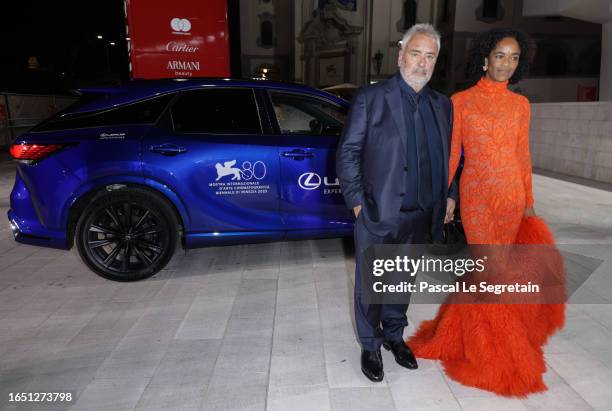 Luc Besson and Virginie Silla arrive on the red carpet ahead of the "Dogman" screening during the 80th Venice International Film Festival at Palazzo...