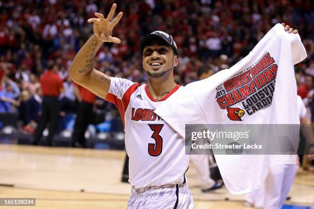 Peyton Siva of the Louisville Cardinals celebrates on court after they won 85-63 against the Duke Blue Devils during the Midwest Regional Final round...