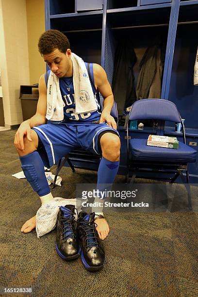 Seth Curry of the Duke Blue Devils sits in the locker room dejected after they lost to the Louisville Cardinals 85-63 during the Midwest Regional...