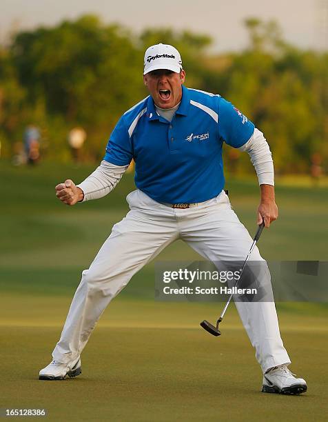 Points celebrates his par putt on the 18th green during the final round of the Shell Houston Open at the Redstone Golf Club on March 31, 2013 in...