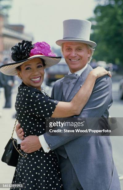 Welsh singer Shirley Bassey with her manager Beaudoin Mills during Royal Ascot at Ascot Racecourse in Ascot, England, circa June 1986.