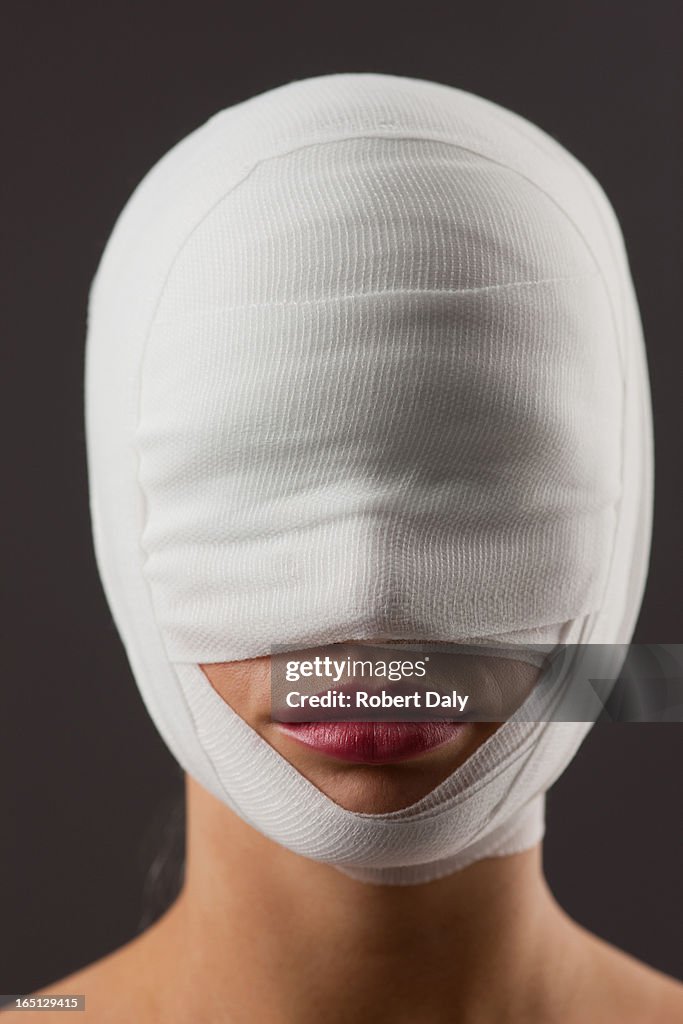 Close up of woman with bandaged face