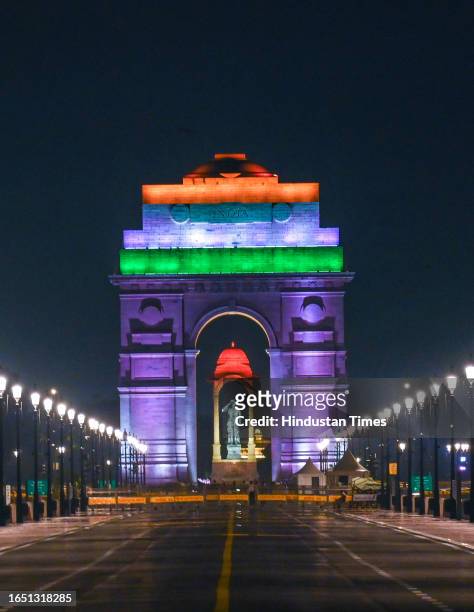 India Gate illuminates in tri-colour for the upcoming G20 Summit, near Kartavya Path, on September 7, 2023 in New Delhi, India. In preparation for...