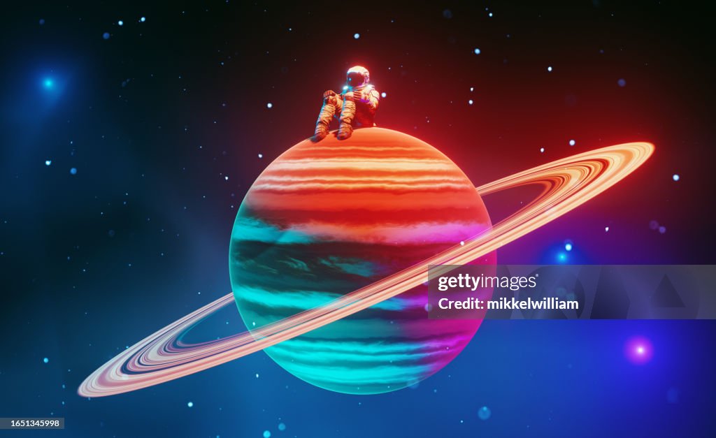 Lonely astronaut sits on colorful tiny planet in the middle of space