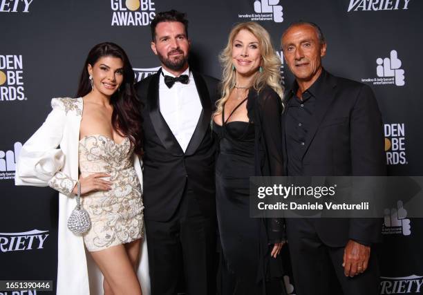 Jacqueline Fernandez, Andrea Iervolino, Gabriella Carlucci and Alberto Barbera attend the Variety and Golden Globes party during The 80th Venice...
