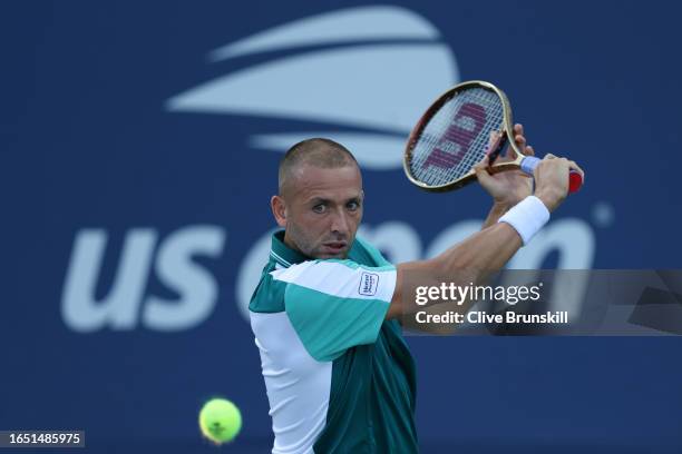 Daniel Evans of Great Britain returns a shot against Botic Van De Zandschulp of the Netherlands during their Men's Singles Second Round match on Day...