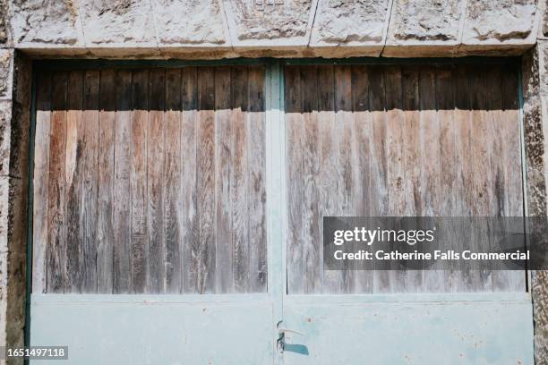 close-up of rustic wooden garage doors - draft period closes stock pictures, royalty-free photos & images