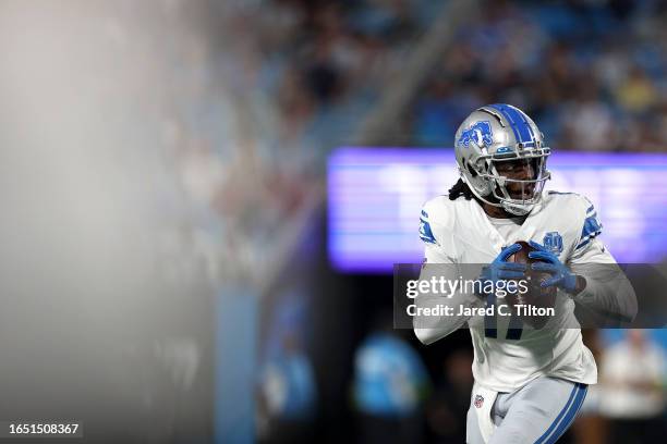 Teddy Bridgewater of the Detroit Lions drops back to pass during the first quarter of a preseason game at Bank of America Stadium on August 25, 2023...