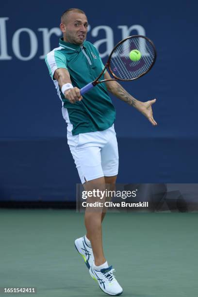 Daniel Evans of Great Britain returns a shot against Botic Van De Zandschulp of the Netherlands during their Men's Singles Second Round match on Day...