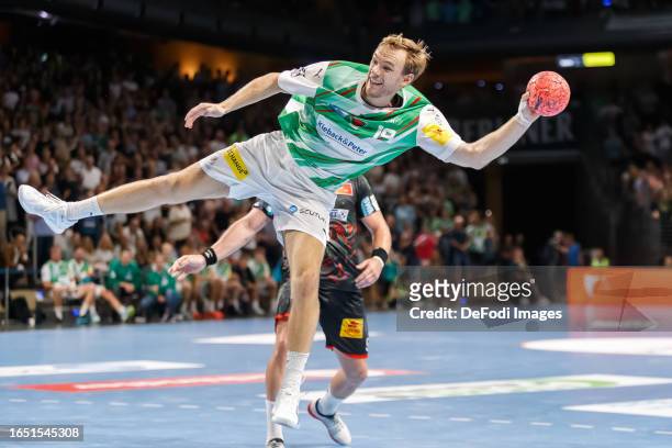 Mathias Gidsel of Fuechse Berlin controls the ball during the Handball-Bundesliga match between Füchse Berlin and SC Magdeburg at Max-Schmeling Hall...