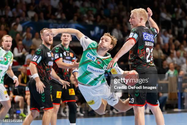 Mathias Gidsel of Fuechse Berlin controls the ball during the Handball-Bundesliga match between Füchse Berlin and SC Magdeburg at Max-Schmeling Hall...