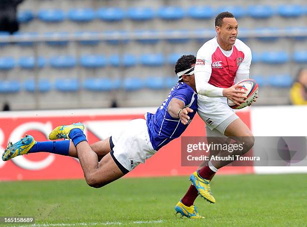 Dan Norton of England passes the ball during the match between England and Samoa during day one of the HSBC Sevens Tokyo at Prince Chichibu Stadium...