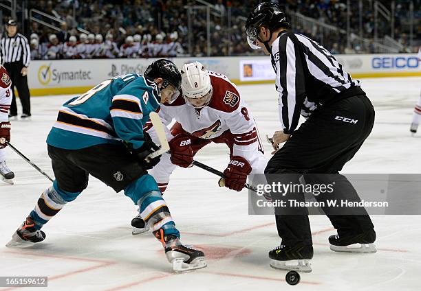 Matthew Lombardi of the Phoenix Coyotes faces off against Joe Pavelski of the San Jose Sharks in the first period at HP Pavilion on March 30, 2013 in...