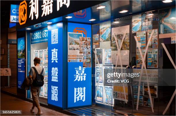 The windows of a store are protected with tape against strong winds before the arrival of typhoon Saola on August 31, 2023 in Hong Kong, China.