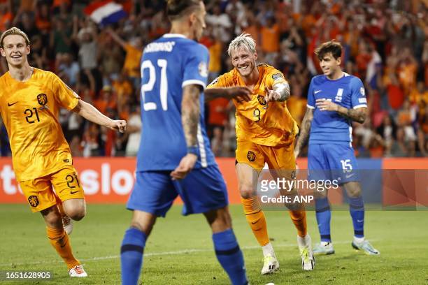 Frenkie de Jong of Holland, Kostas Tsimikas of Greece, Wout Weghorst of Holland celebrate the 3-0, Lazaros Rota of Greece is disappointed during the...