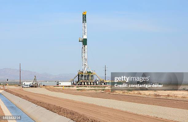 industrial drill rig and water canal landscape - thermal power station stock pictures, royalty-free photos & images